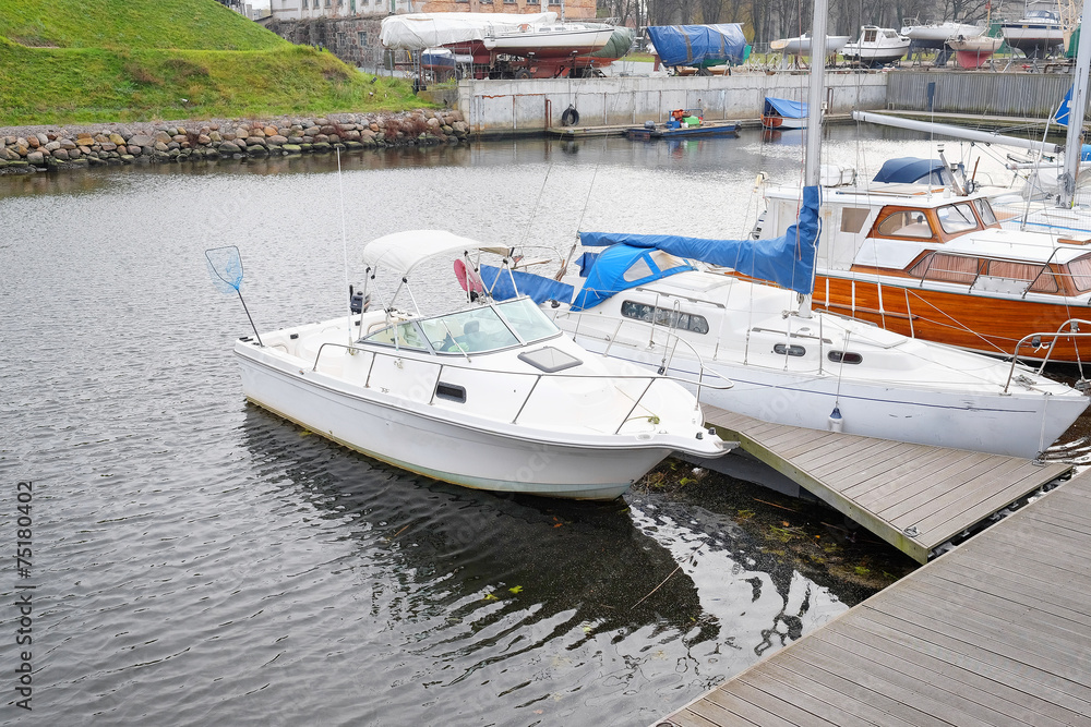 Fototapeta premium motor boat stand at a berth