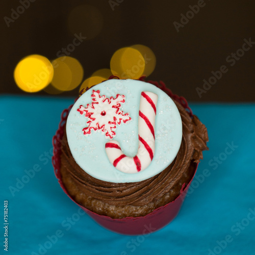 Christmas cupcake with candy decoration photo