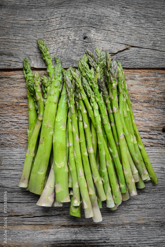 Fresh Asparagus on Rustic Wood Background Fresh Asparagus on Rustic Wood Background
