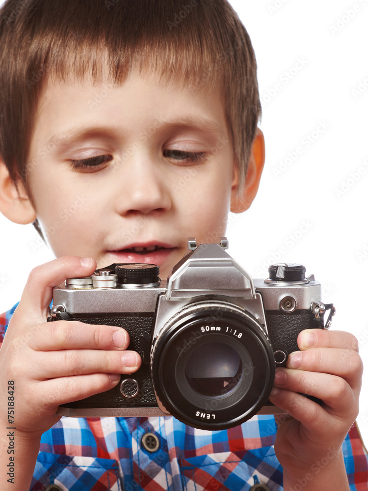 Little boy reporter photographer with SLR camera isolated