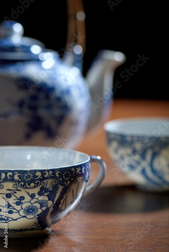 Old Chinese porcelain teapot, with two cups