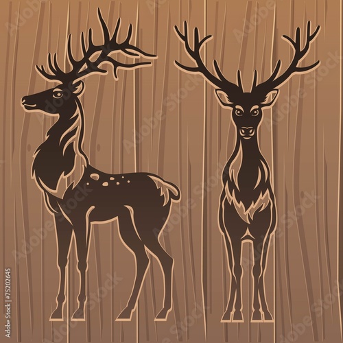 Deers on wood background