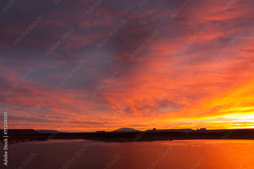 Lake Powell at sunrise, clouds and sunlight