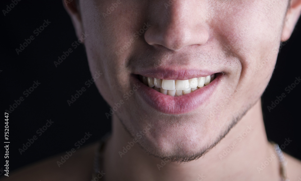White teeth of a smiling young man White teeth of a smiling young man
