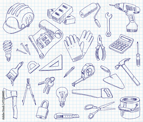 Freehand drawing building materials on a sheet of exercise book