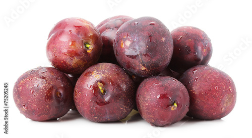 purple plums group isolated on the white background