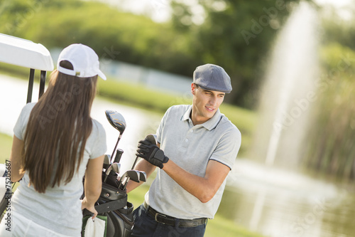 Young couple at golf court