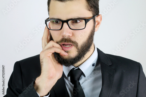 pensive business man on a white background