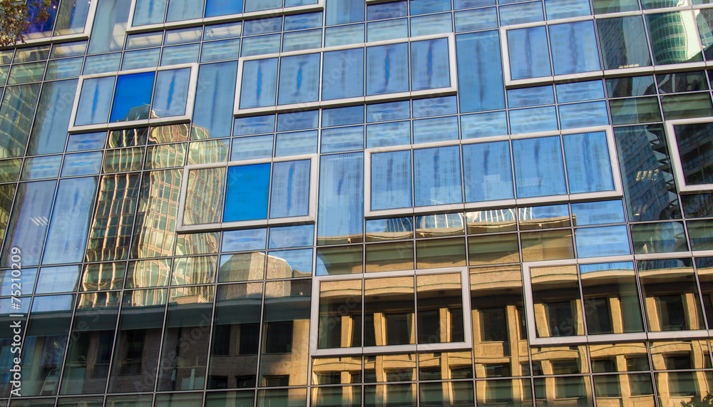 Facade with reflection of skyscrapers in Frankfurt, Germany