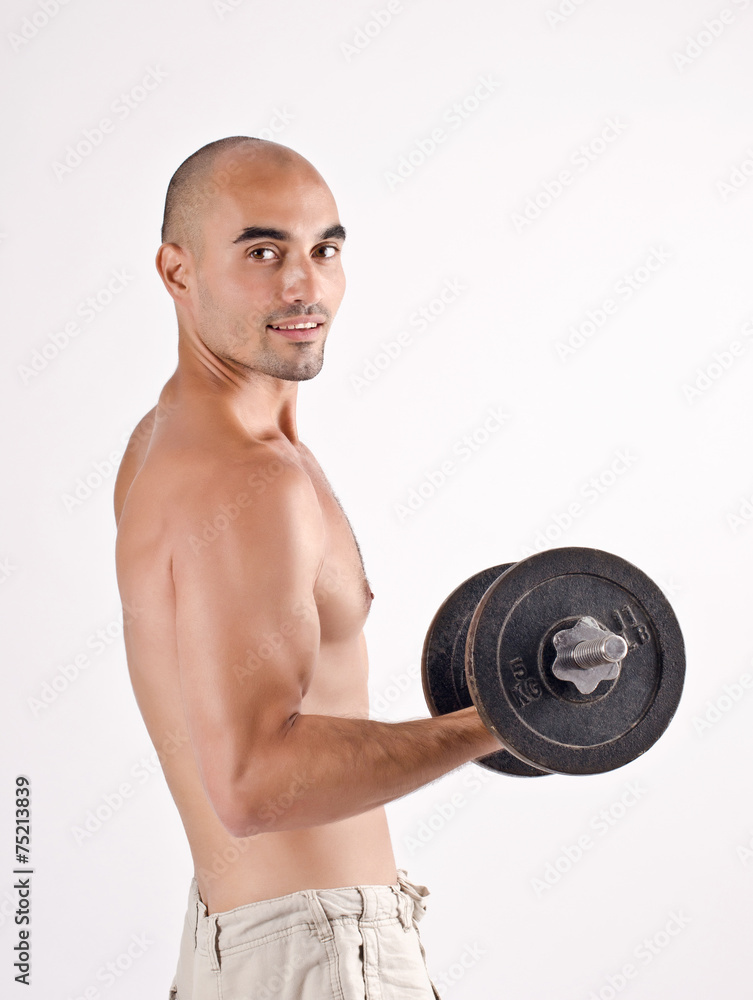 Strong man lifting weights for the biceps. Bodybuilder training. Strong man lifting weights for the biceps. Bodybuilder training.