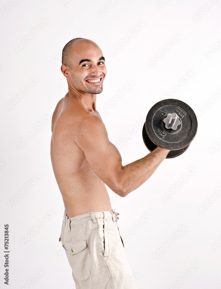 Strong man lifting weights for the biceps. Bodybuilder training.
