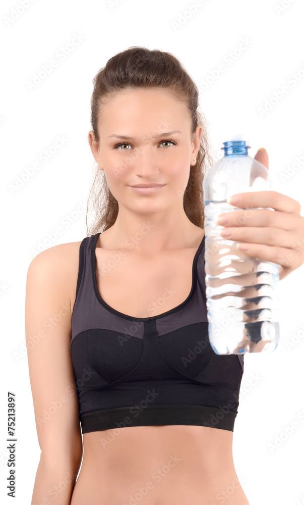 Girl holding a bottle of water. Focus model, blur bottle. Girl holding a bottle of water. Focus model, blur bottle.