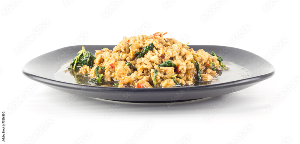 Thai spicy food Stir fried chicken with basil on white Thai spicy food Stir fried chicken with basil on white