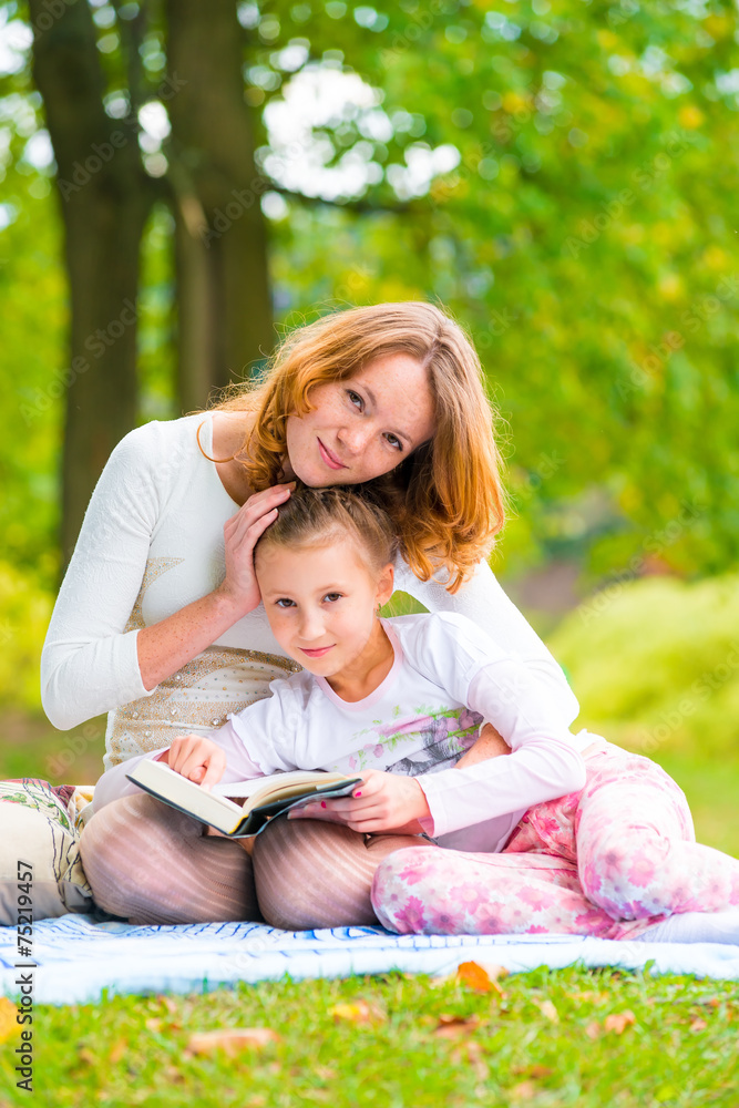 portrait of mother and daughter in the summer park portrait of mother and daughter in the summer park