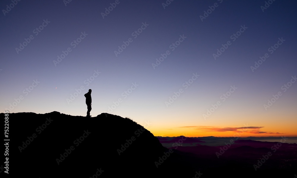A man playing sports in the mountains at sunset, Euskadi