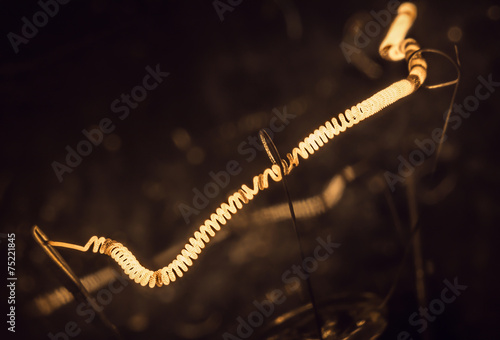 фотографія Macro photo of a incandescence thread of lamp