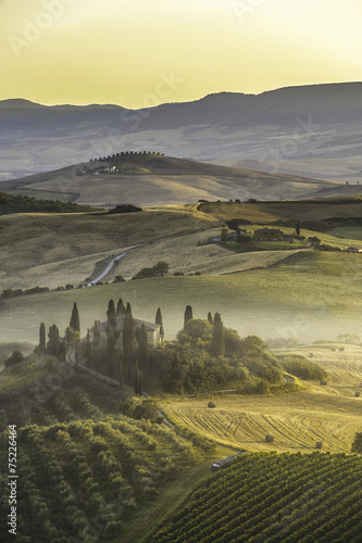 Beautiful view of the misty valley in the rural Tuscan landscape