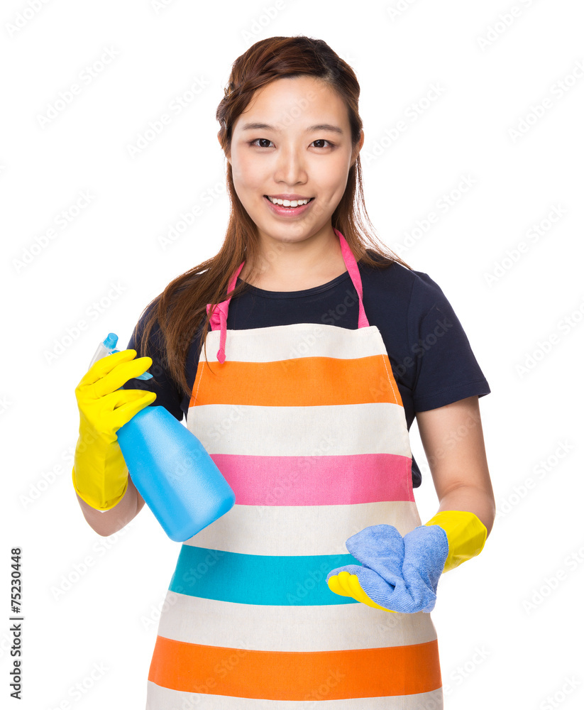 Housewife holding rag and detergent spray Housewife holding rag and detergent spray