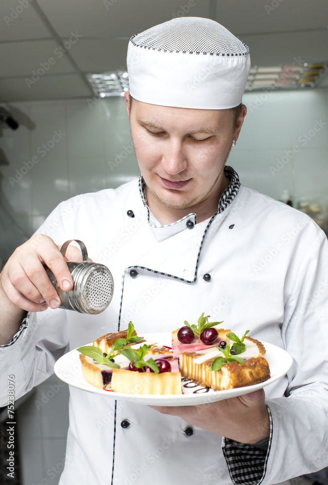 chef preparing food in the kitchen at the restaurant chef preparing food in the kitchen at the restaurant