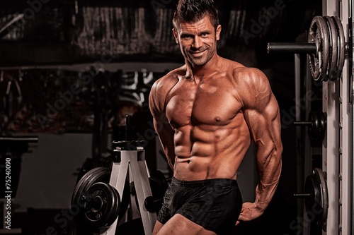 Bodybuilder posing in the gym