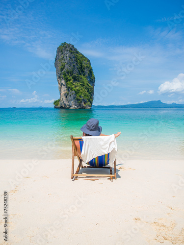 Fototapeta Naklejka Na Ścianę i Meble -  Man relaxing on the beach in Thailand