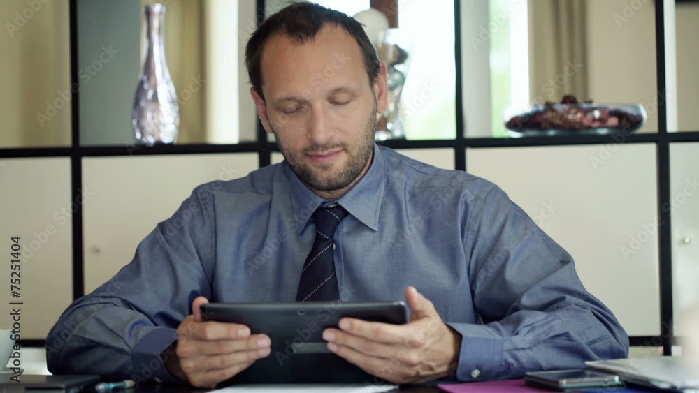 Portrait of happy, successful businessman with tablet computer Portrait of happy, successful businessman with tablet computer
