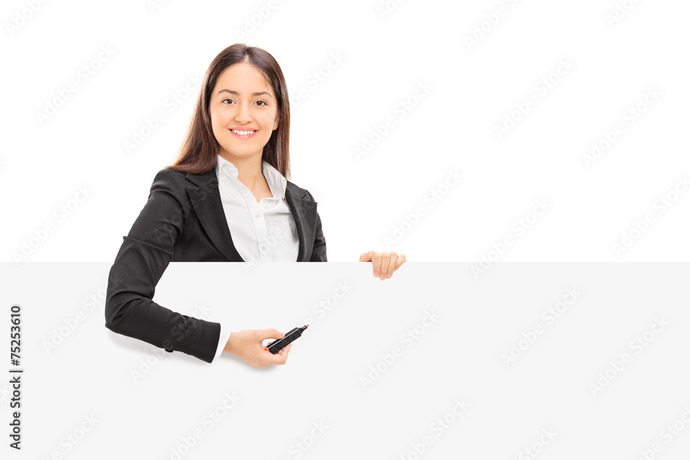 Pretty businesswoman trying to write notes on a panel Pretty businesswoman trying to write notes on a panel