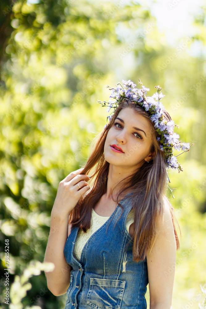 pretty young woman with flower wreath on her head pretty young woman with flower wreath on her head