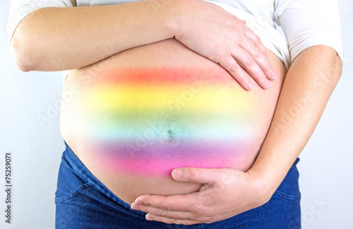 Pregnant woman belly with rainbow symbol LGBT