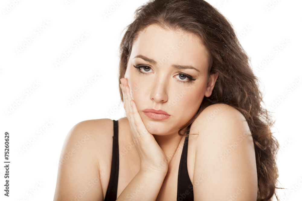 Fototapeta premium young woman has a severe toothache