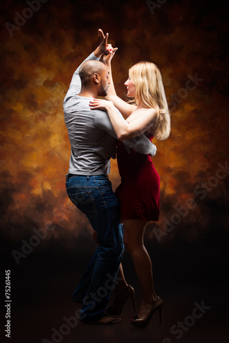 Young couple dances Caribbean Salsa