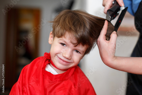 Little boy at barber photo