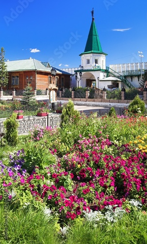 Flowers and tower at Holy Trinity monastery in Tyumen