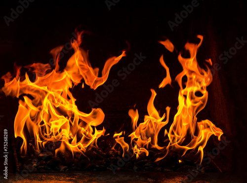 fire in a oven, two flames on the black background