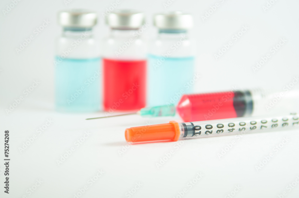 Disposable syringe and injection vial background Disposable syringe and injection vial background