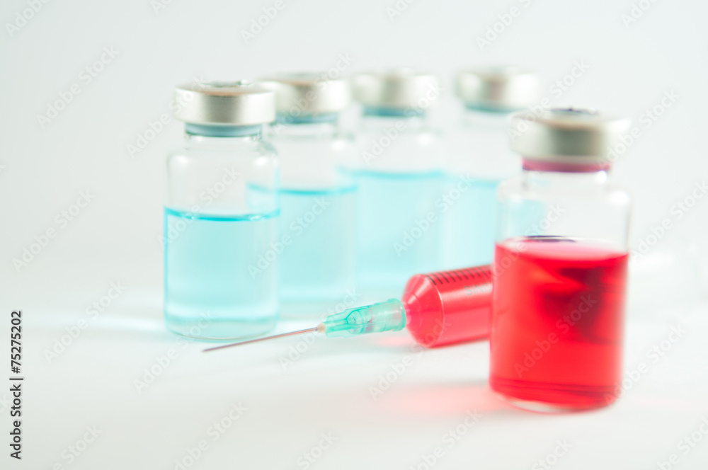 Red liquid in injection syringe and vials Red liquid in injection syringe and vials