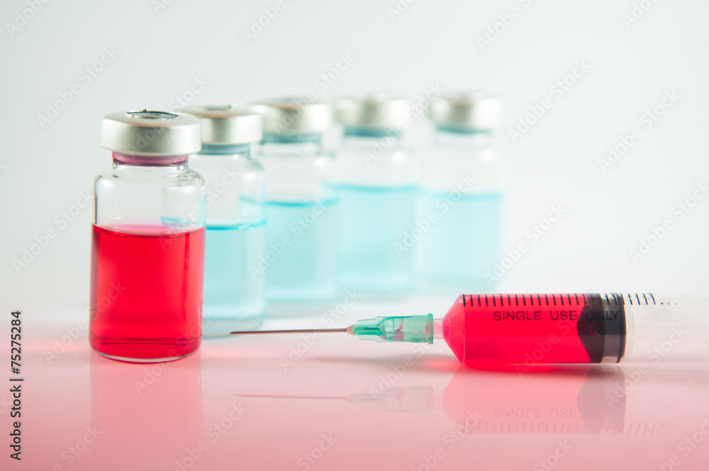 Red liquid in injection syringe and vials Red liquid in injection syringe and vials