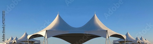 row of white tent tops photo