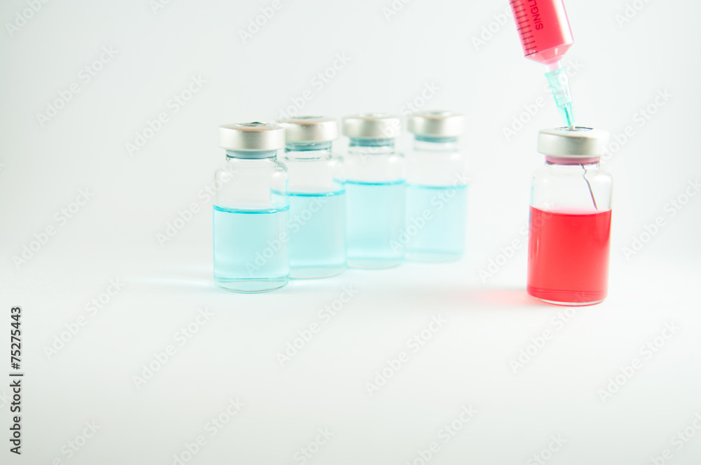 Red liquid in injection syringe and vials Red liquid in injection syringe and vials