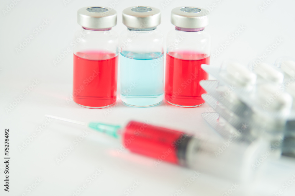 Red liquid in injection syringe and vials Red liquid in injection syringe and vials