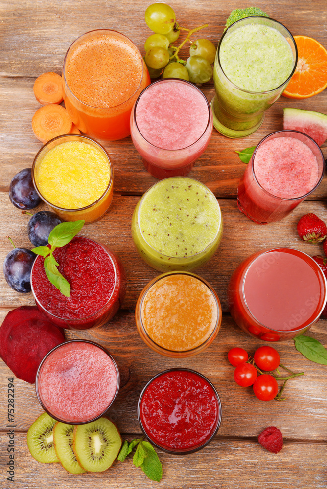 Glasses of tasty fresh juice, on wooden table. Glasses of tasty fresh juice, on wooden table.