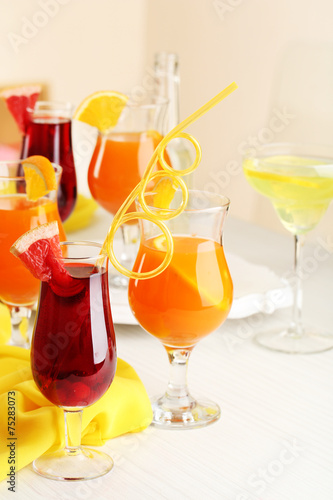 Glasses of fruit cocktails in party close-up