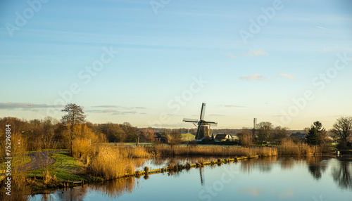 Landscape with windmill and river