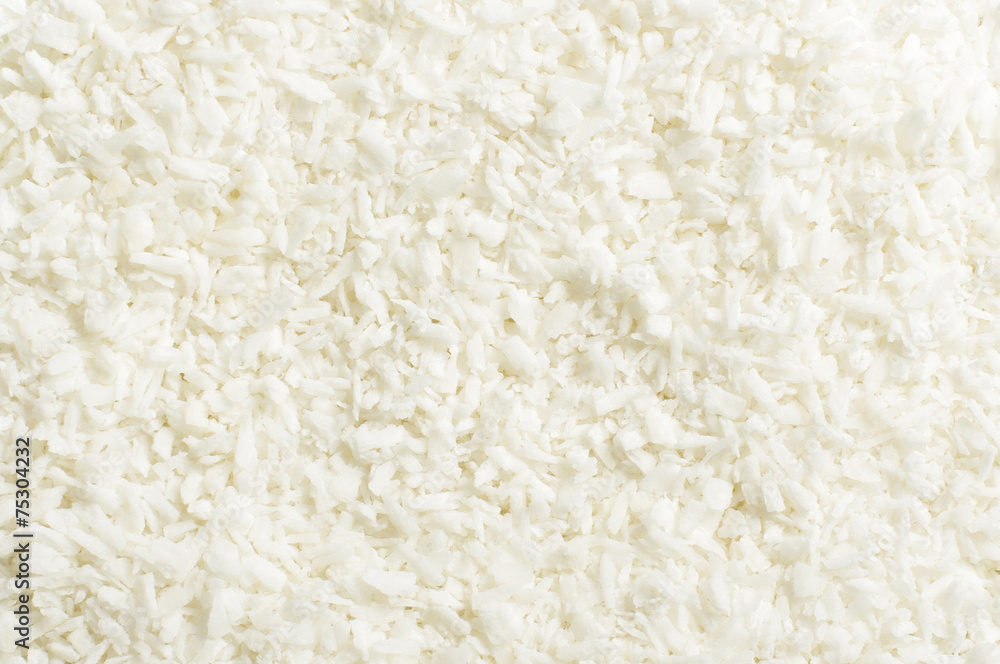 Shredded coconut shavings abstract texture background Shredded coconut shavings abstract texture background