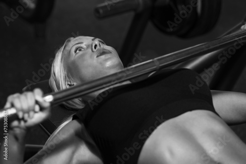 Young Woman On Bench Press
