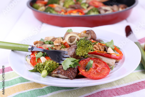 Braised wild mushrooms with vegetables and spices in pan and