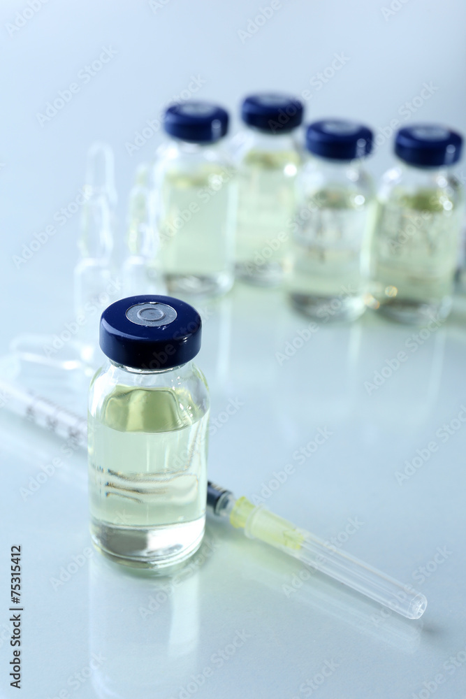 Vaccine in vial with syringe Vaccine in vial with syringe