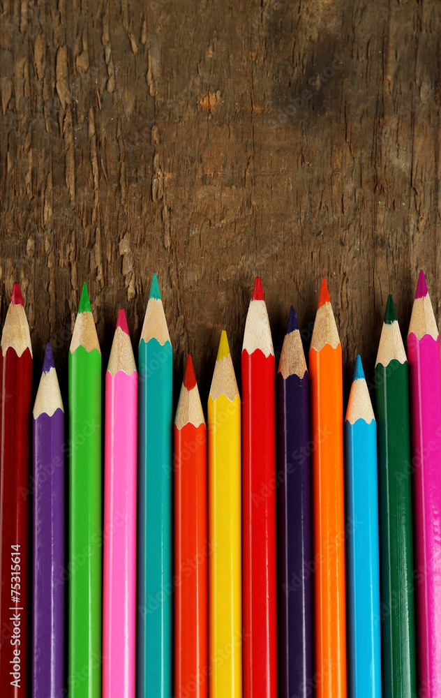 Colorful pencils on rustic wooden background Colorful pencils on rustic wooden background