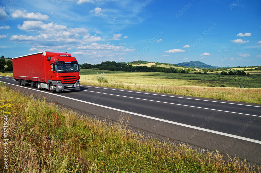 Rural landscape with road you are driving a red truck