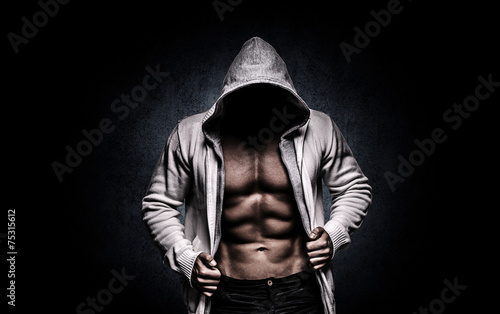 Canvas Print strong athletic man on black background